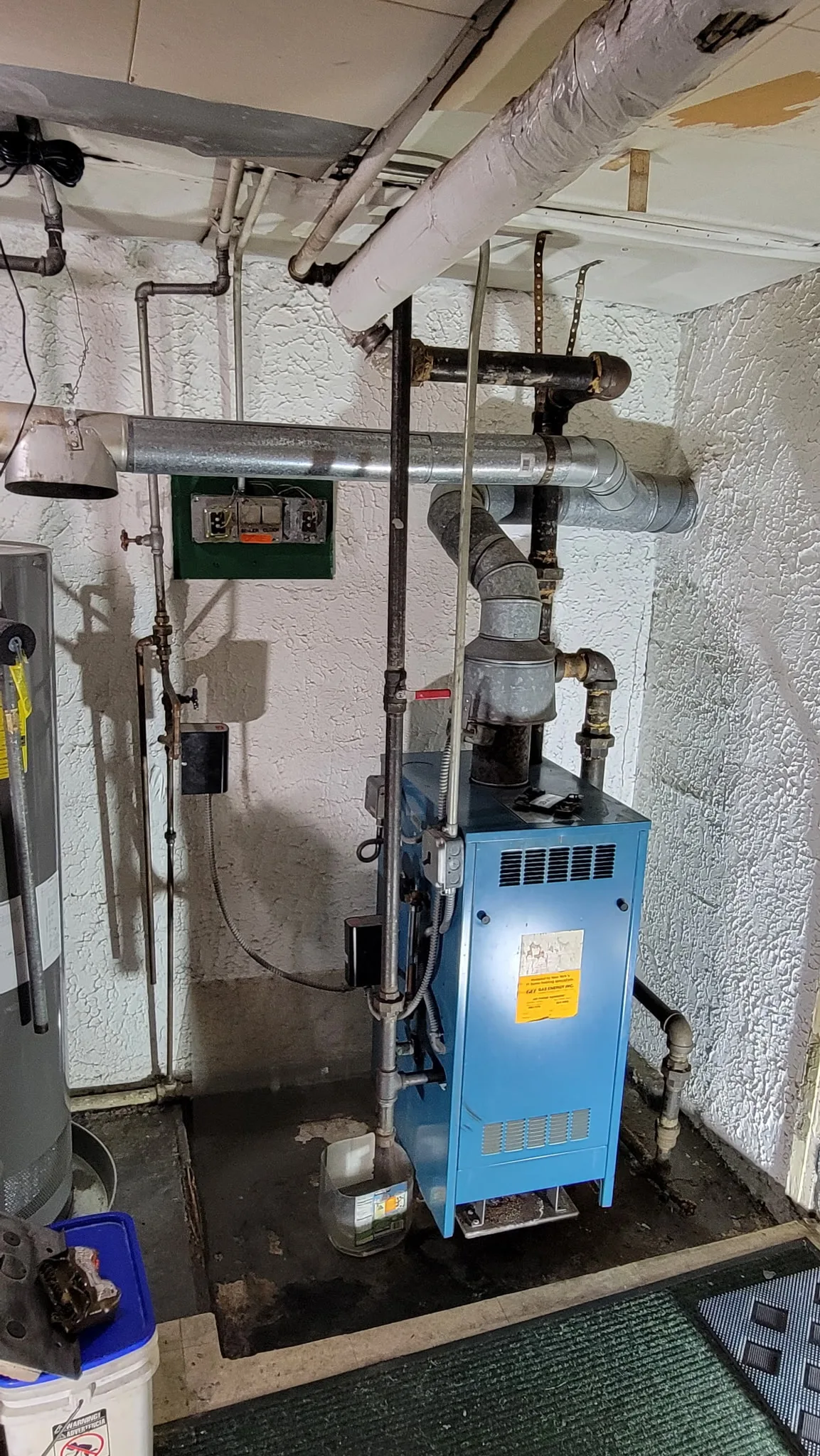 Replacement gas boiler installed in a residential basement